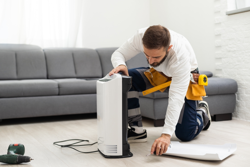 Young,Man,Changing,-,Fixing,A,Dirty,Air,Purifier,Hepa